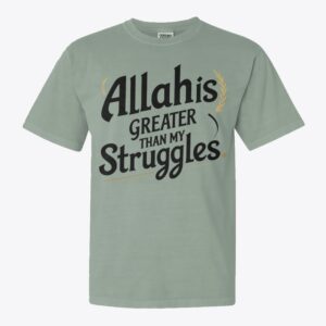 Minimalist Islamic T-shirt design with the quote “Allah is Greater than my struggles” in bold modern typography on a solid background